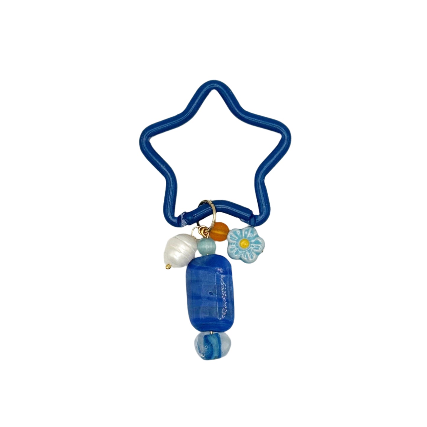 Blue star-shaped hair tie with decorative elements on a white background