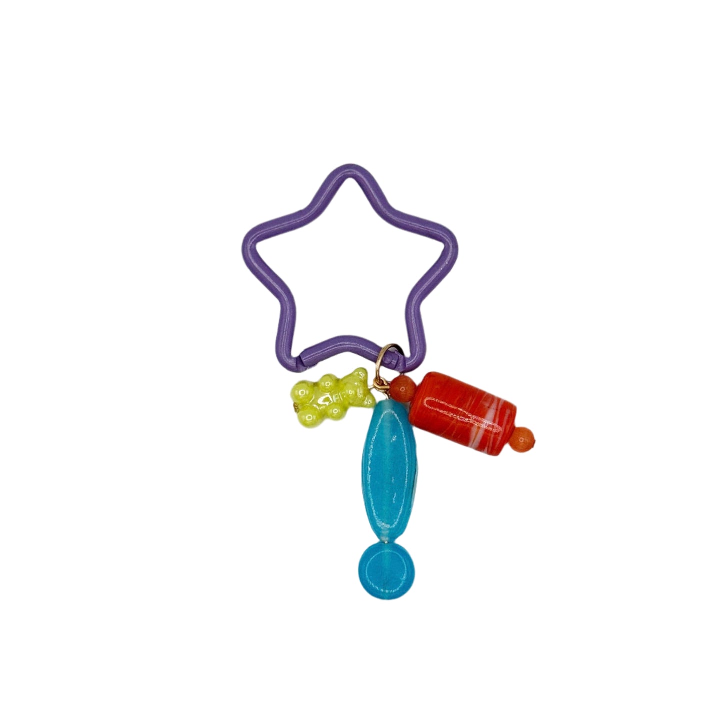 Colorful keychain with star-shaped rubber band, blue charm, and red bottle-like object on a white background