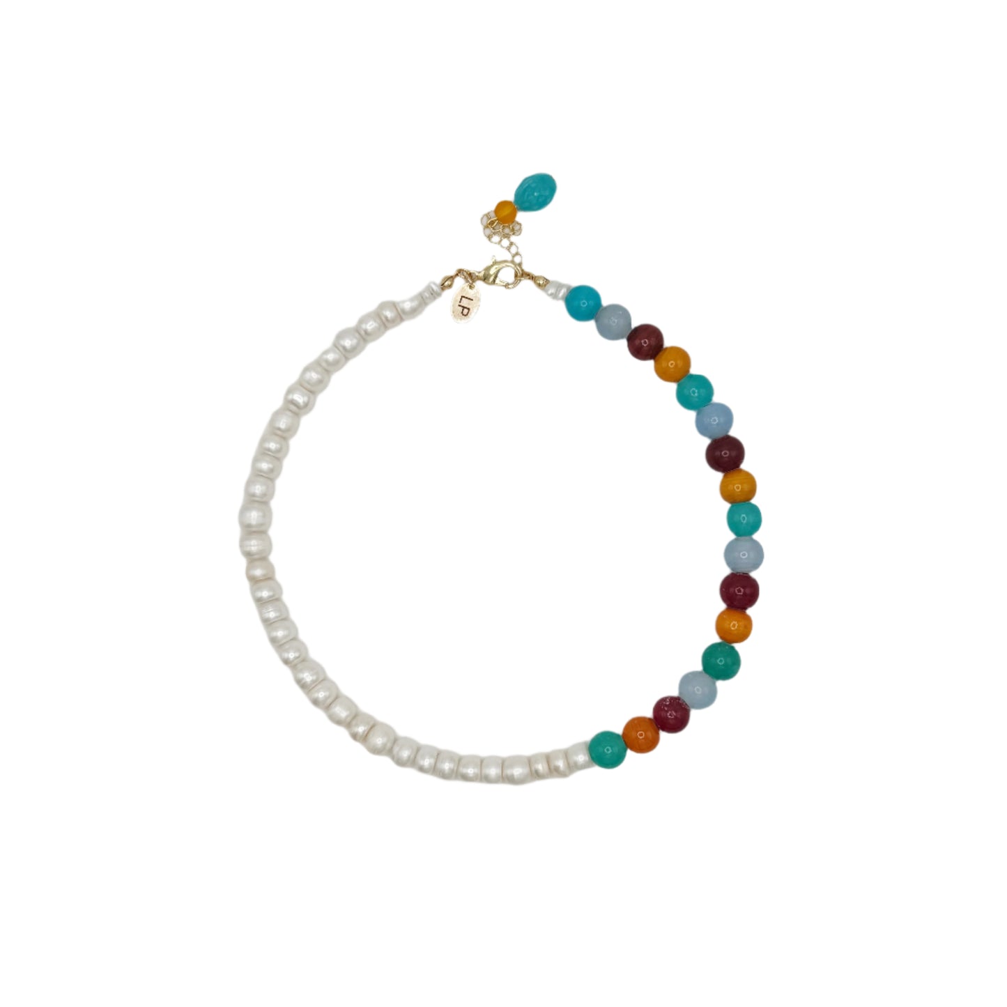 Necklace with pearls and multicolored beads on a light gray background