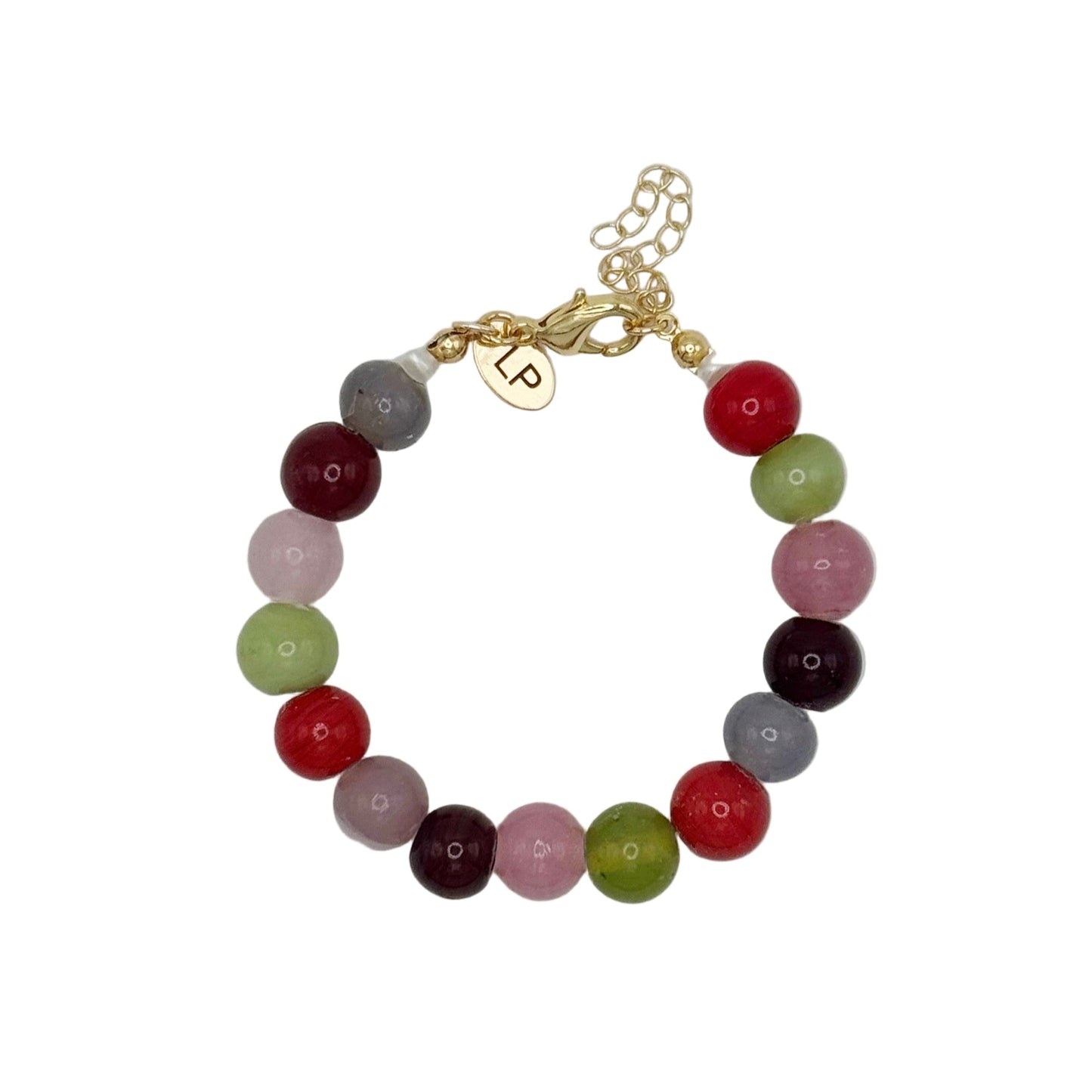 Beaded bracelet with multicolored beads and a gold charm on a white background