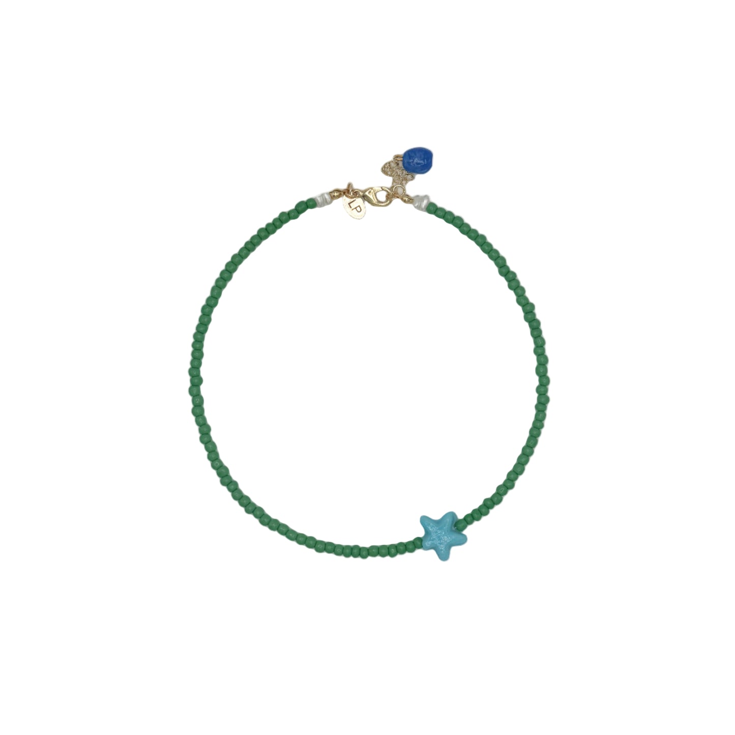Green beaded bracelet with a blue star charm on a gray background