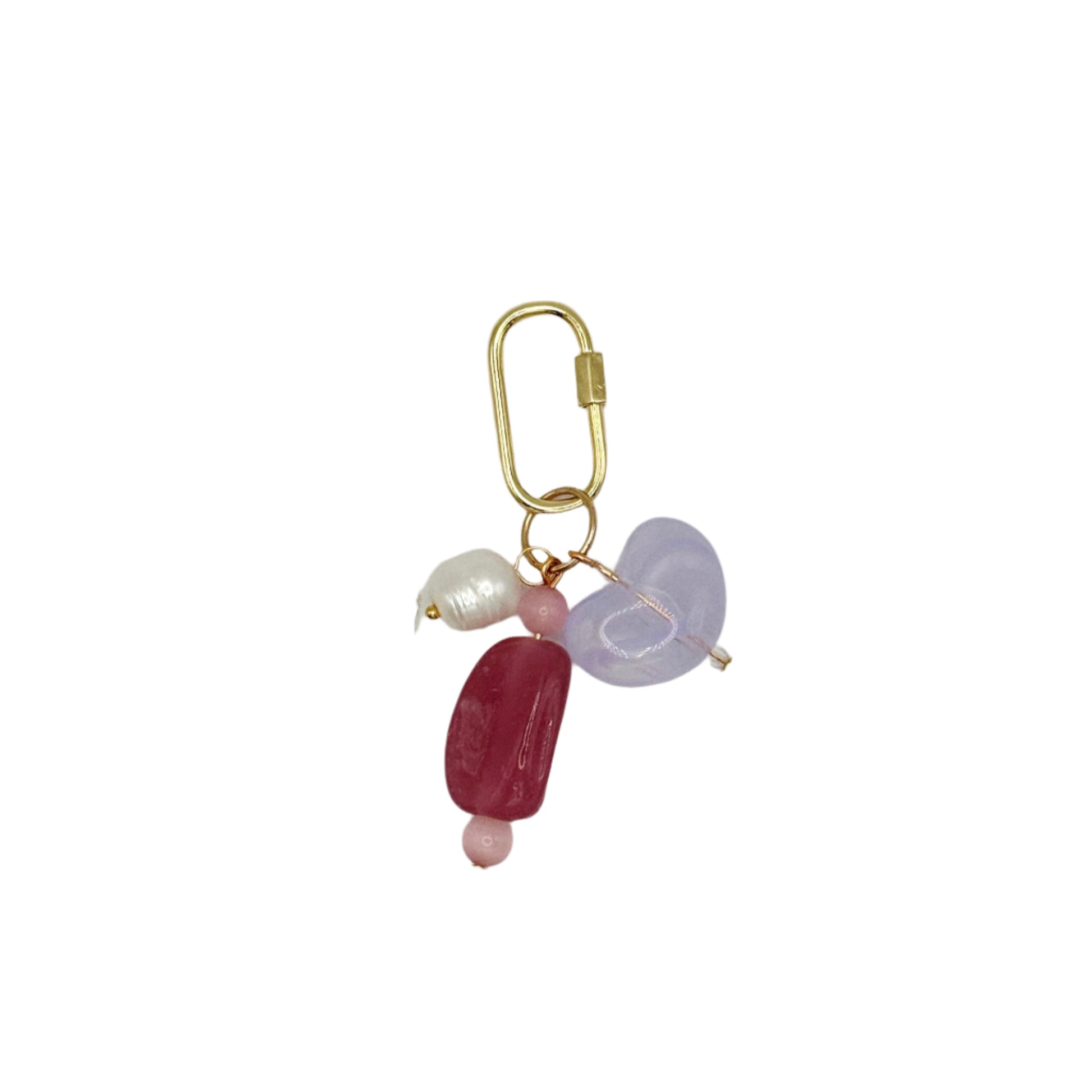 Gold keychain with pink and purple beads on a white background