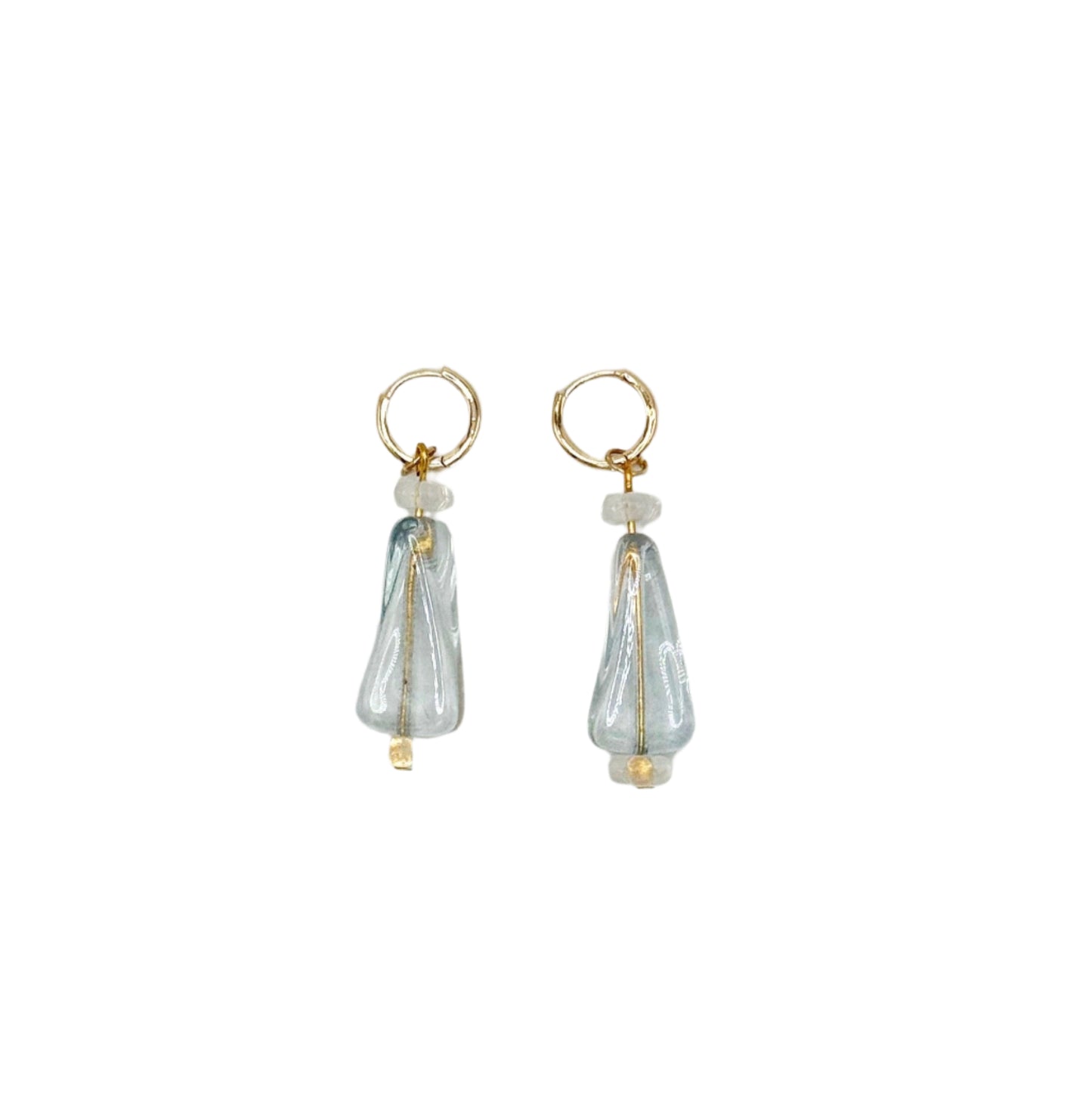Pair of earrings with clear teardrop-shaped charms on a white background