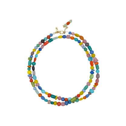 Colorful beaded necklace on a light gray background