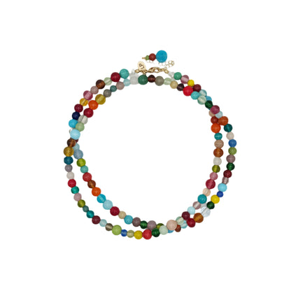 Multicolored beaded necklace on a white background