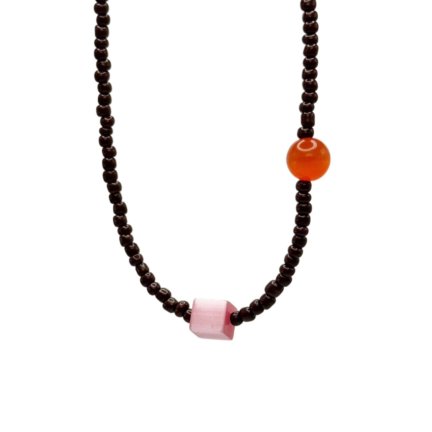 Necklace with brown beads and colored stones on a light gray background