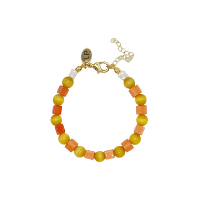 Beaded bracelet with orange and yellow beads on a white background