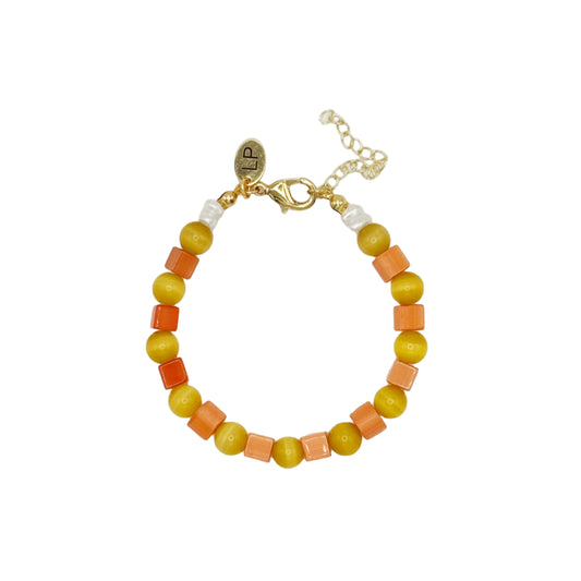 Beaded bracelet with orange and yellow beads on a white background