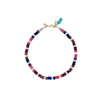 Multicolored beaded necklace on a light gray background