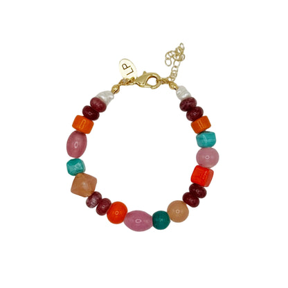 Multicolored beaded bracelet on a light gray background