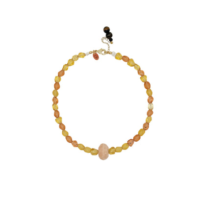 Necklace with multicolored beads on a white background