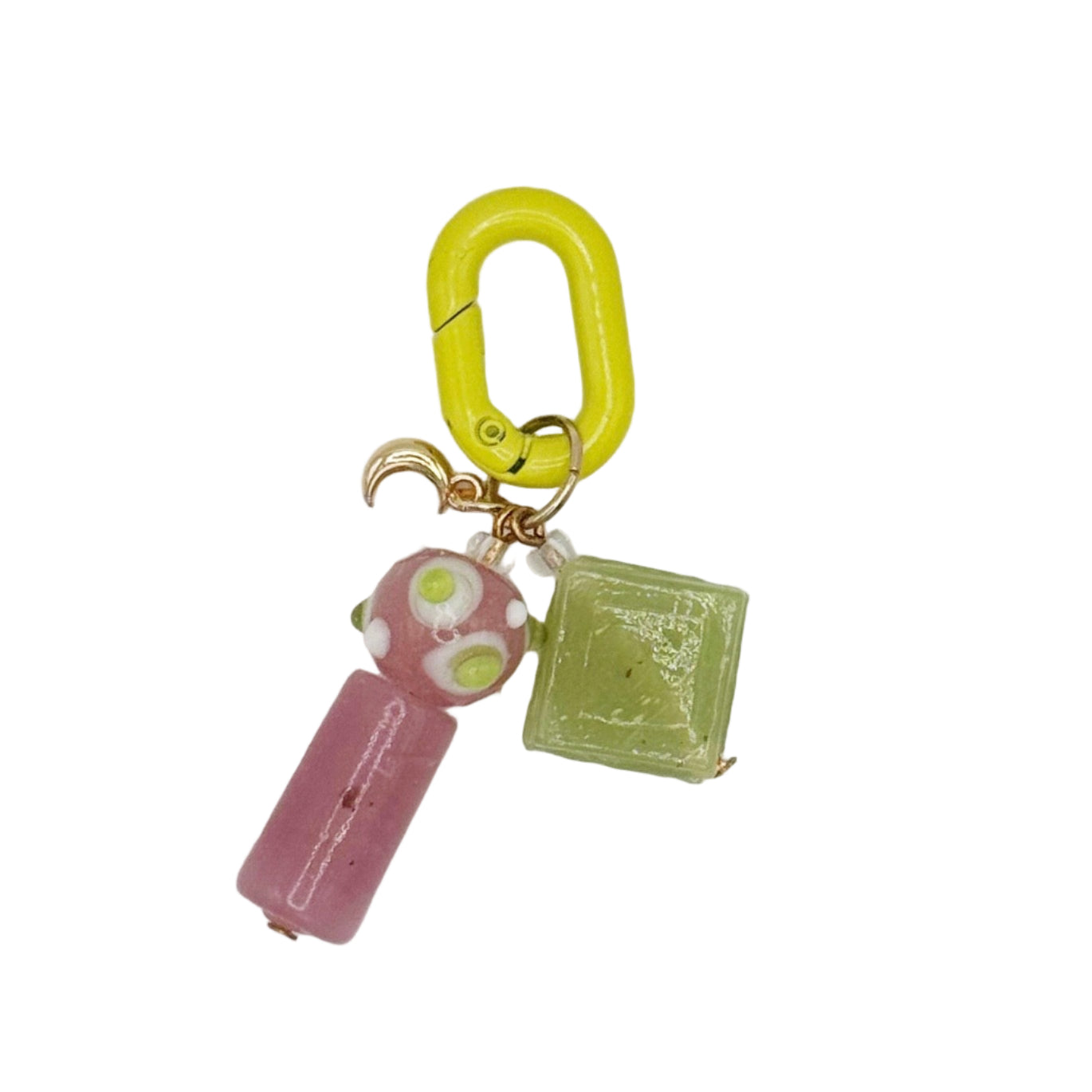Keychain with pink and green charms on a white background