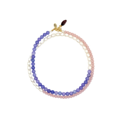 Multicolored beaded necklace on a white background