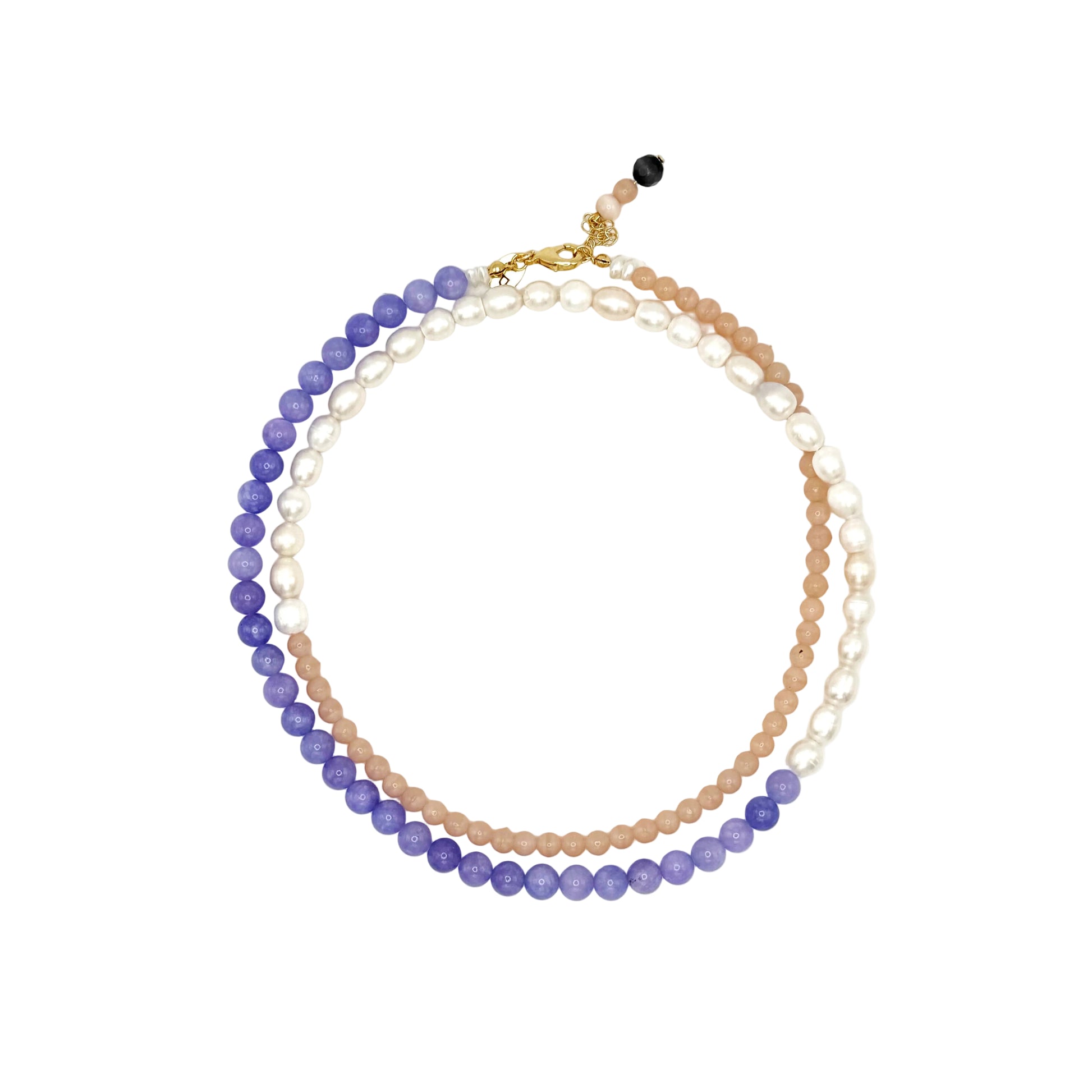 Stack of beaded necklaces on a white background