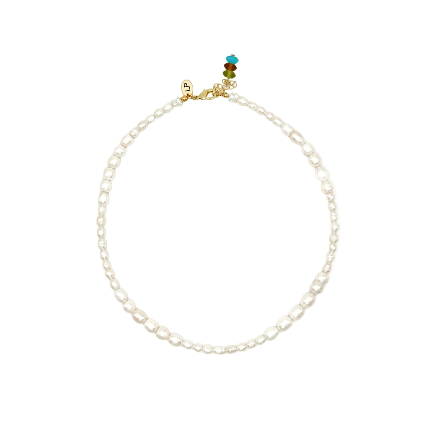 Pearl necklace with a small multicolored bead on a white background