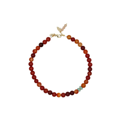 Necklace with multicolored beads on a white background