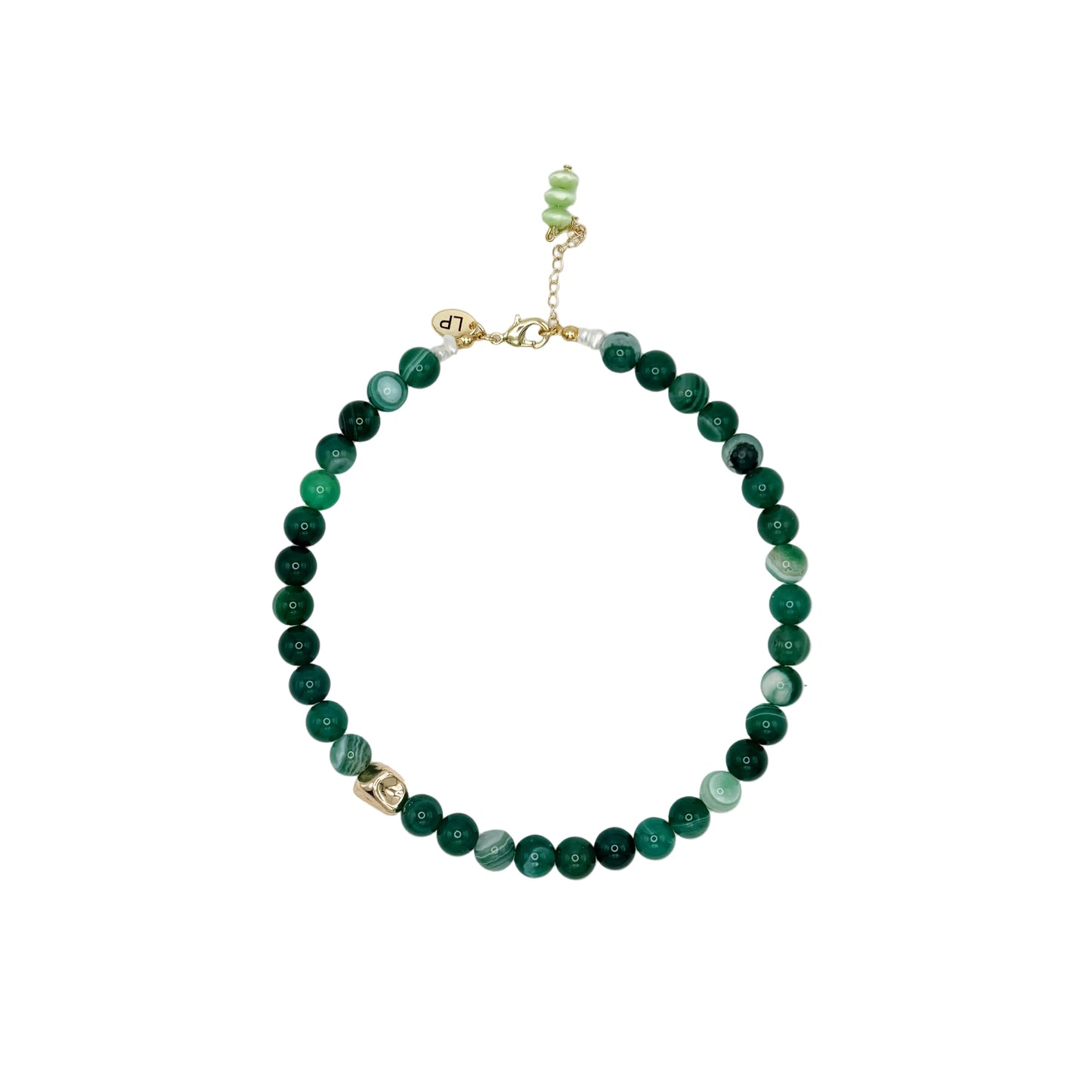 Green beaded necklace on a white background