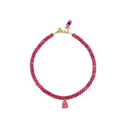 Pink beaded necklace with a gold clasp on a white background