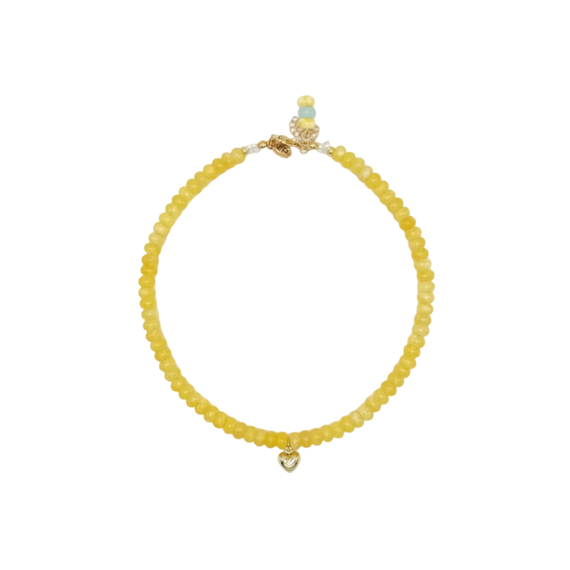 Yellow beaded bracelet with a heart charm on a white background
