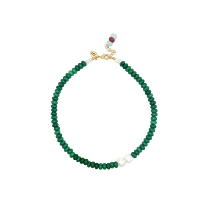 Green beaded necklace with freshwater pearls on a white background