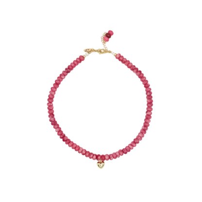 Pink beaded necklace with a gold clasp on a white background