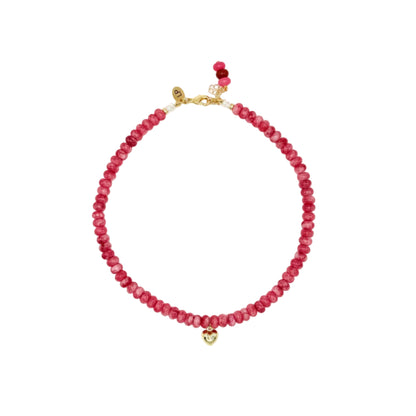 Pink beaded necklace with gold clasp on a white background