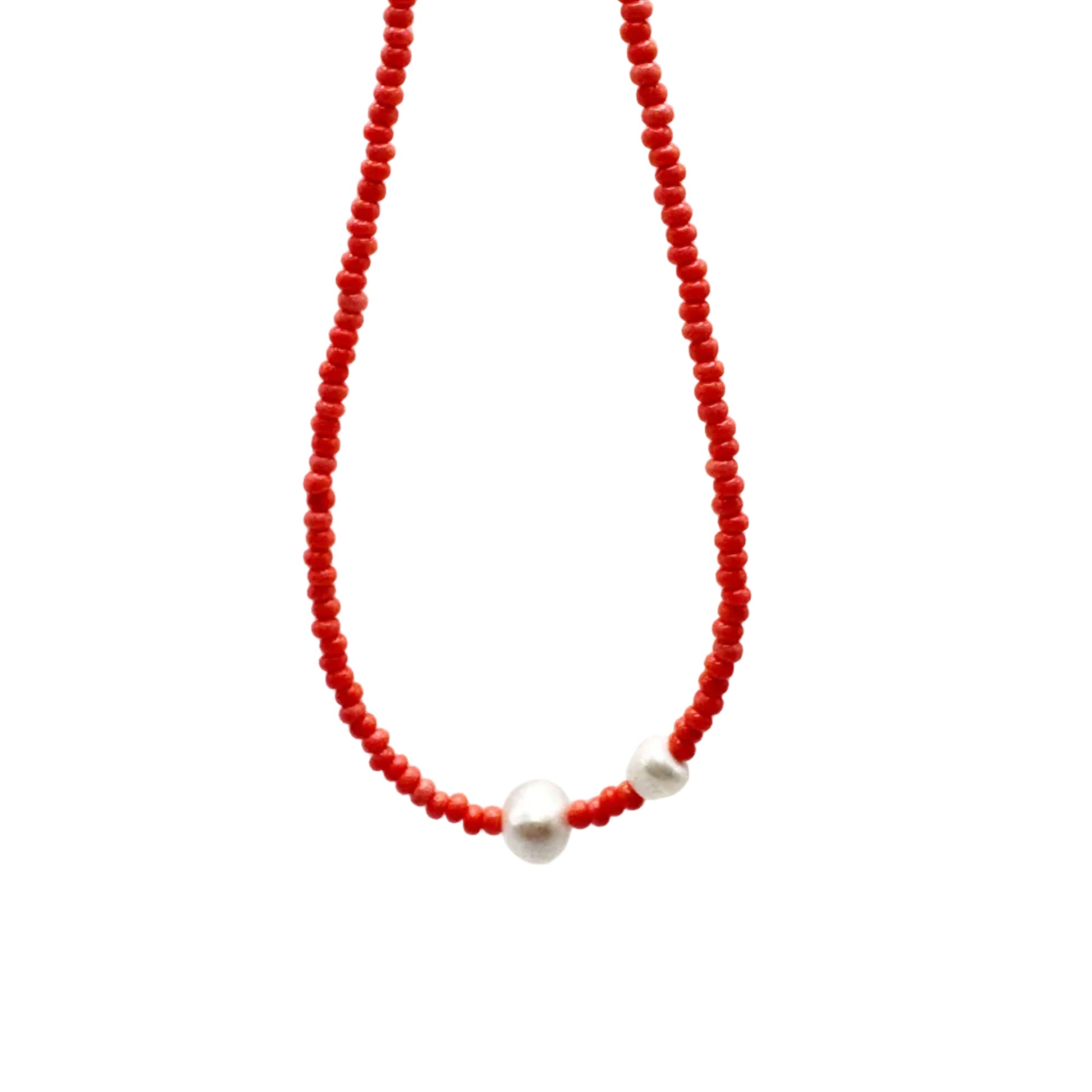 Red beaded necklace with a white pearl on a white background