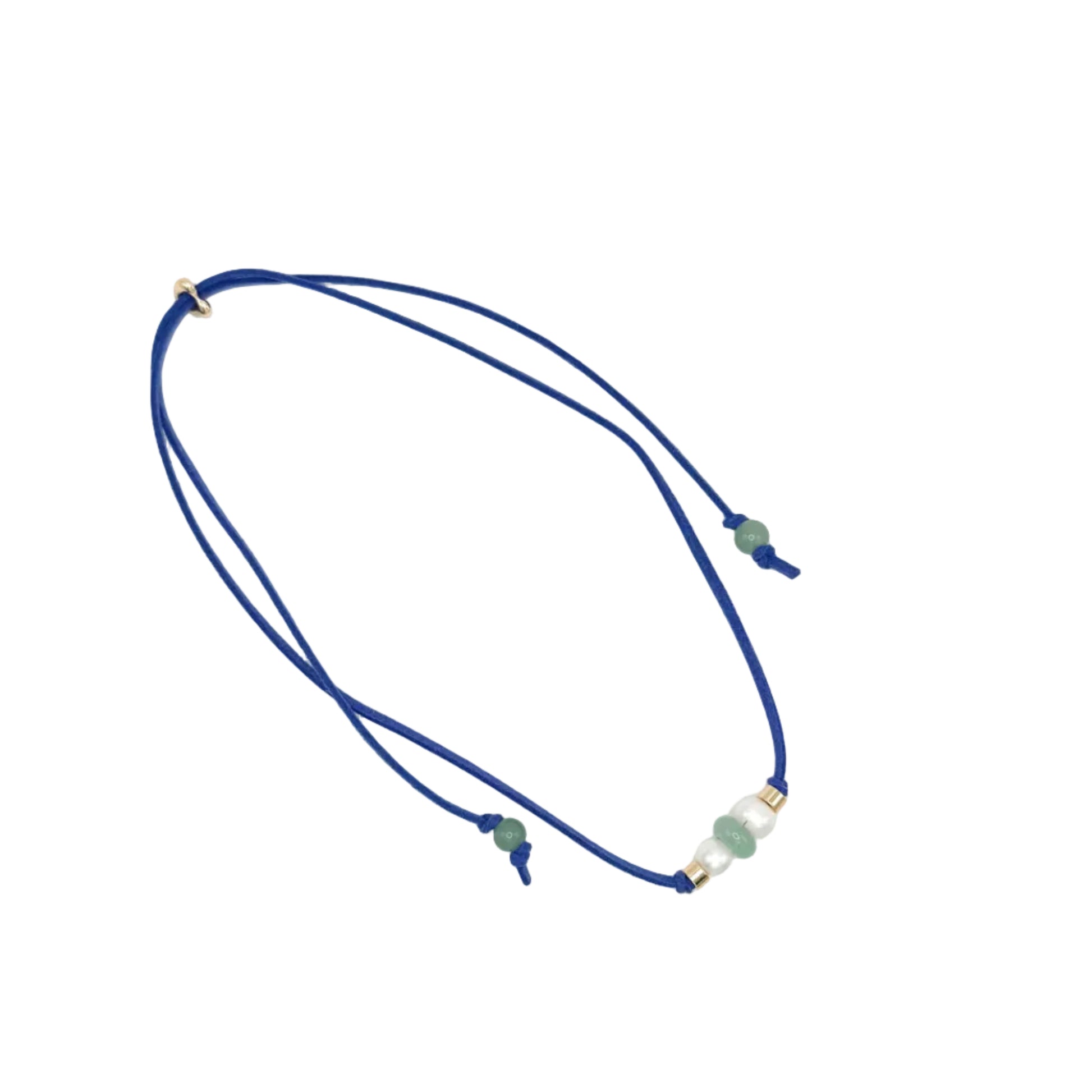 A double-strand navy blue cord necklace with small green beads and gold spacer rings, displayed on a clean white background.