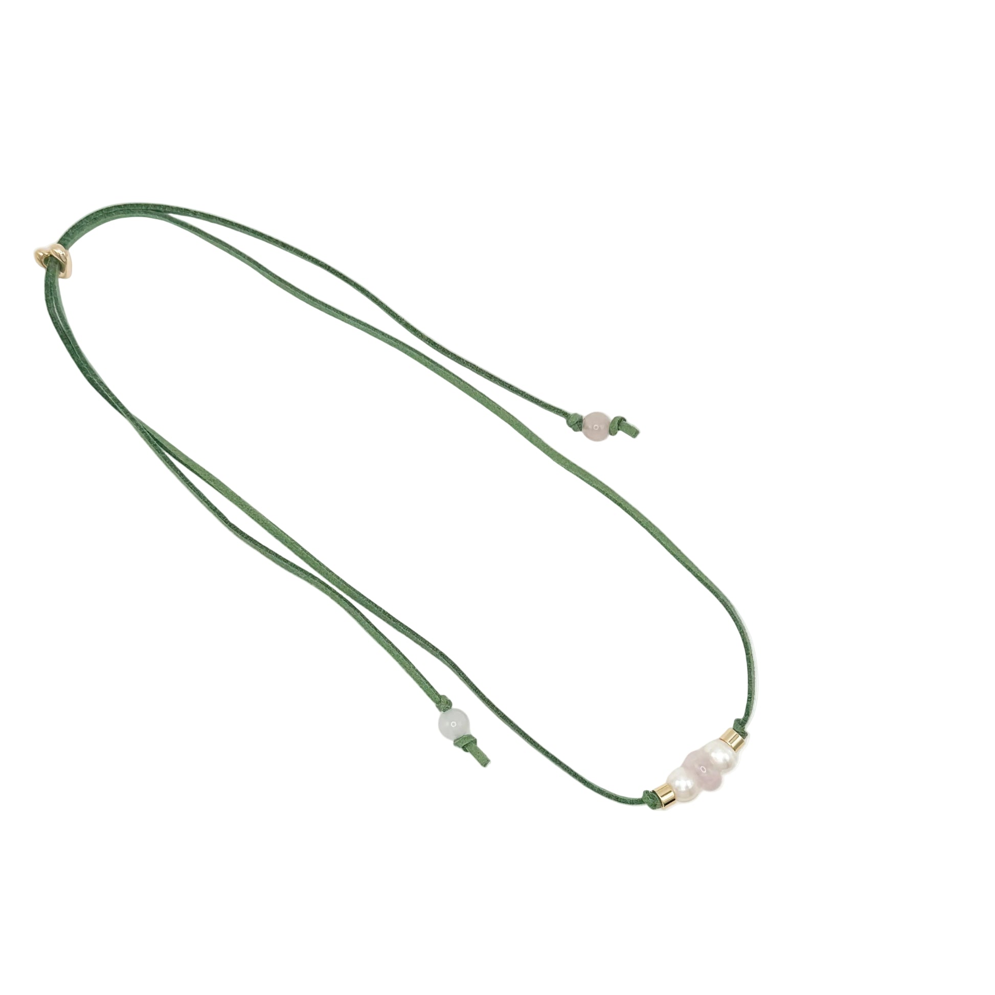 A dark green cord necklace featuring a central cluster of pale pinkish-white beads and small gold spacer rings, displayed on a clean white background.