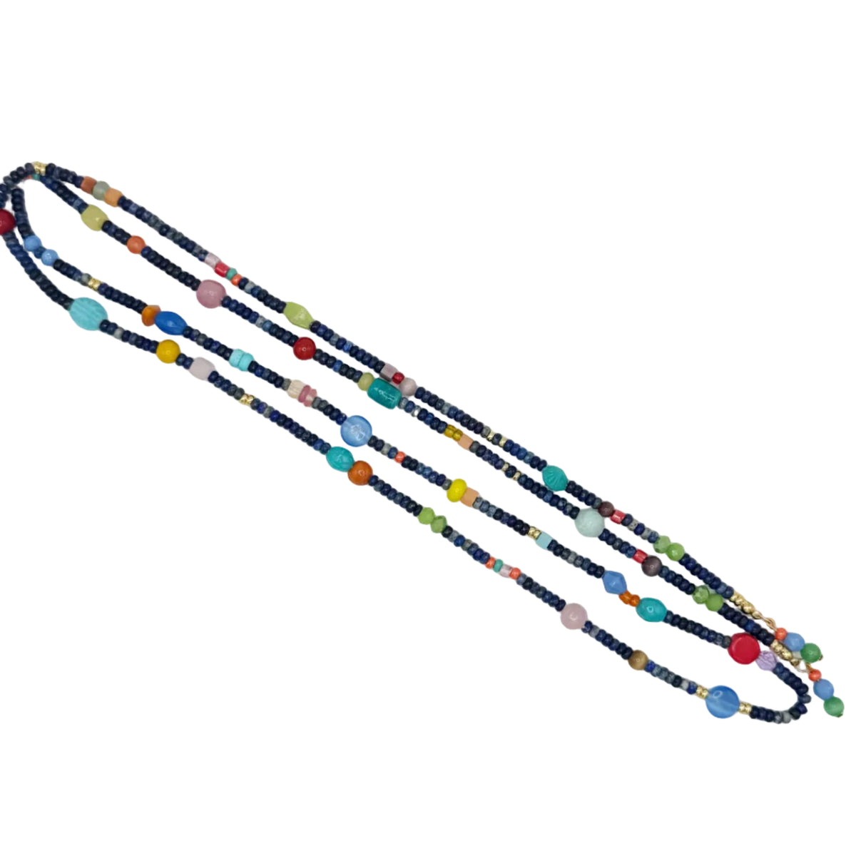 A long beaded necklace laid diagonally on a plain white background. The necklace features dark navy blue beads with small colorful accents in red, yellow, orange, green, pink, and light blue.