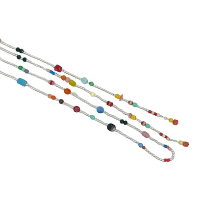 Four silver chain necklaces with colorful, varied bead strands laid out diagonally on a plain white background.