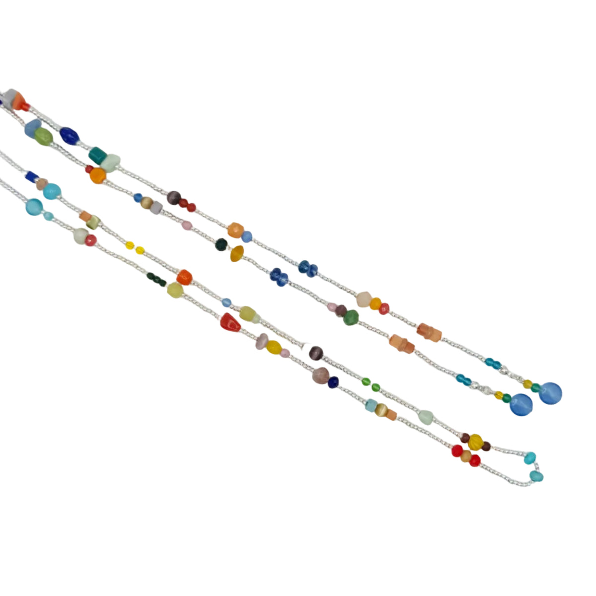 Three long beaded strands or cords laid diagonally on a plain white background. The beads are in many different colors including blue, green, orange, yellow, red, and brown, with some larger polished beads and smaller spacer beads.