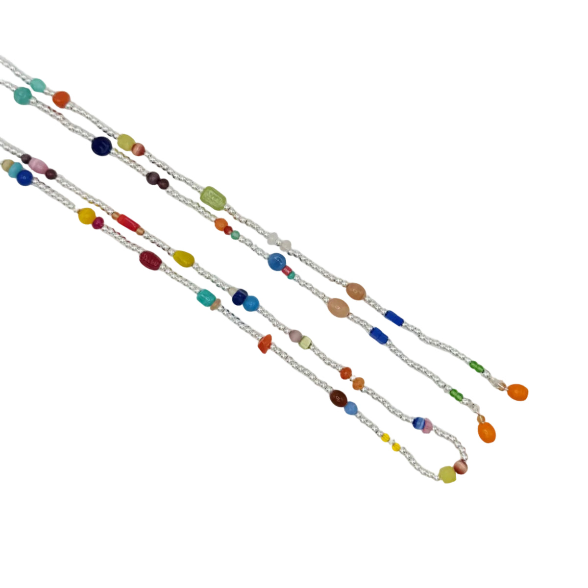 A long silver chain necklace with multiple strands of colorful glass beads, laid diagonally on a plain white background.
