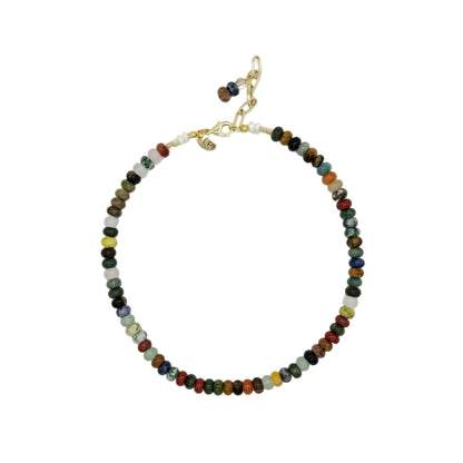 A beaded necklace with small, multi-colored round beads in shades of green, red, yellow, blue, and black, accented by gold-toned metal clasp and connector.