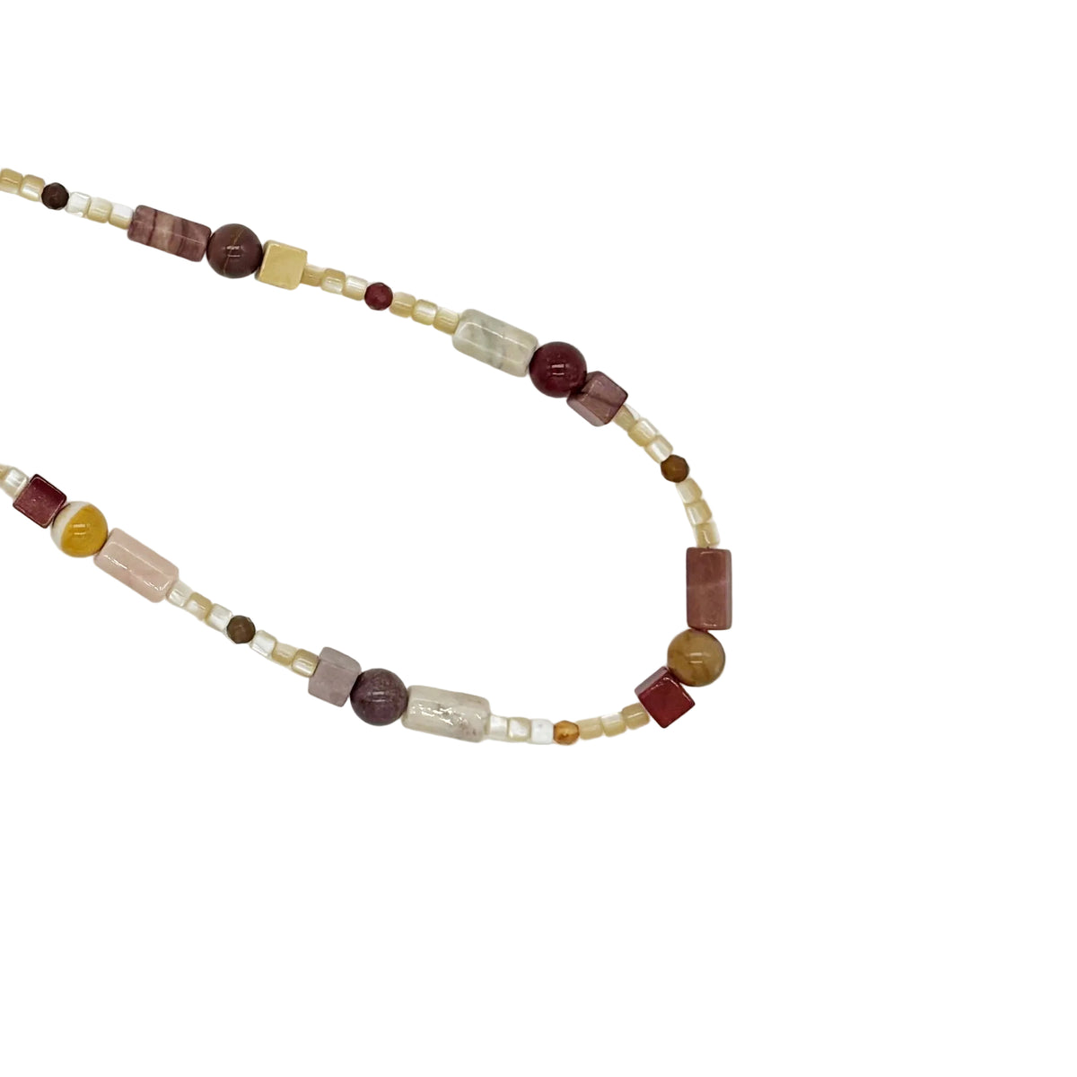A beaded strand necklace featuring a mix of translucent white beads, dark brown and burgundy beads, pale pink and yellow heart-shaped beads, and clear cylindrical beads, arranged on a plain white background.