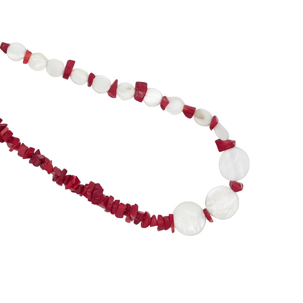 A beaded necklace featuring round white mother-of-pearl discs and textured red chip beads, laid out on a clean white background.