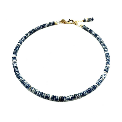Necklace with blue beads on a white background