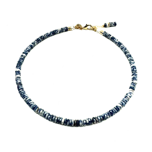 Necklace with blue beads on a white background