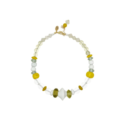 A beaded necklace with a gold clasp, featuring translucent white beads, light blue-green beads, yellow disc beads, and a central white oval bead, displayed on a clean white background.
