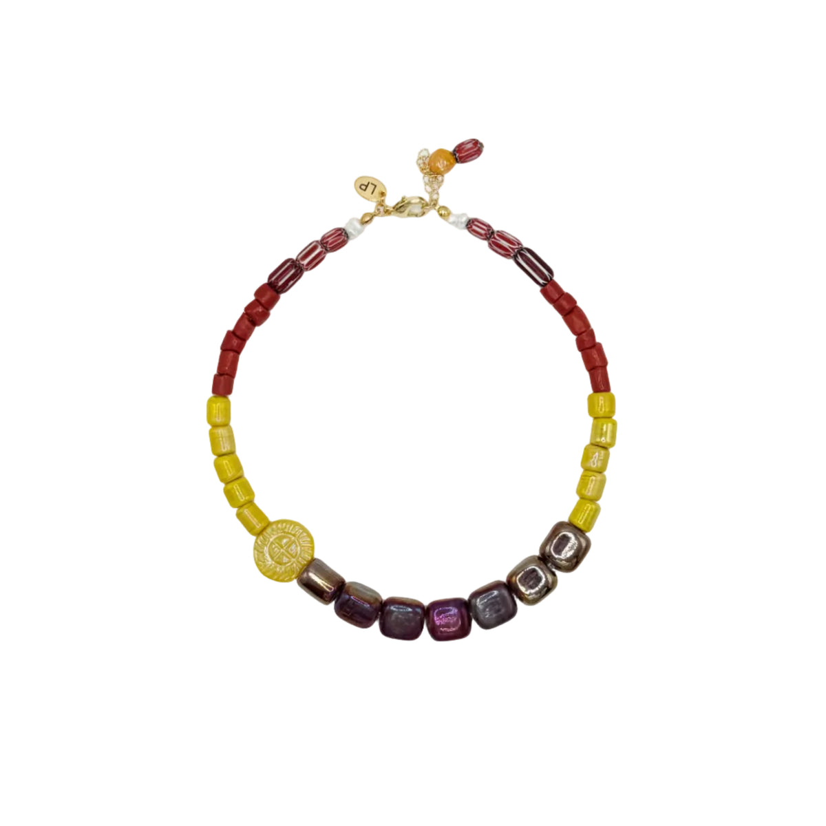 A beaded necklace with alternating sections of red and yellow cylindrical beads, accented by a gold coin charm and a row of purple and brown faceted beads, displayed on a clean white background.