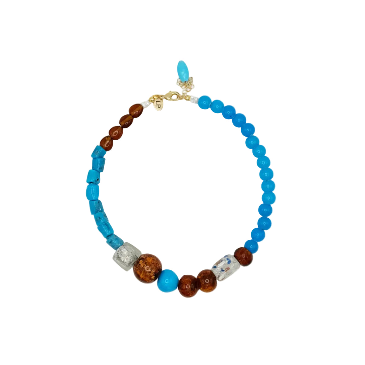 A beaded necklace featuring bright turquoise blue beads, brown wooden beads, a silver-toned textured spacer, a white and blue patterned spacer, and a small turquoise drop charm, displayed on a clean white background.